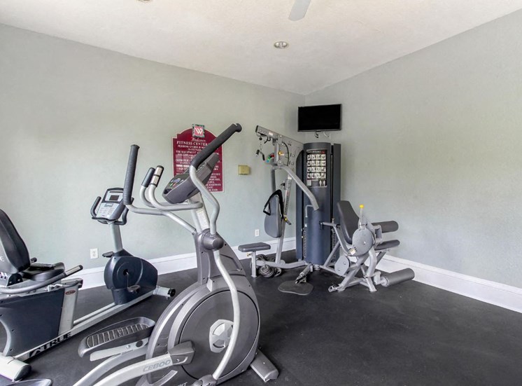 Fitness Center with Exercise Equipment and Mounted TV